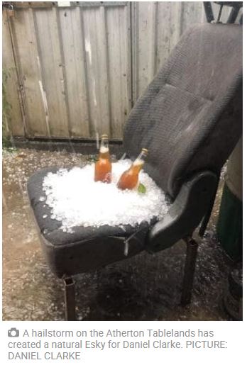 Old Car seat that was outside in a storm, collected a pile of hail and somebody put a couple of bottles of beer in hail - as a makeshift Esky.